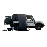White Ineos Grenadier off-road vehicle with an Alu-Cab Roof Conversion and Shower Cube accessories. Camp 4x4 