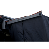 Close-up of the Alu-Cab Shower Cube with Adjustable Curtain with dark blue fabric with a buckle. Camp 4x4