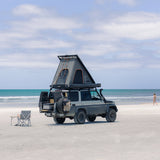 Camper van with an Alu-Cab Gen3.R rooftop tent on a sandy beach. Camp4x4. camp 4x4, overlanding, camping. Off-road