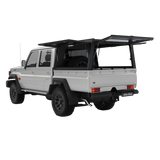 Land Cruiser 79, fitted with the Alu-Cab Explorer Canopy, with doors opened, with treaded or smooth finish. Camp4x4 camp 4x4, overlanding, camping. Double Cab. Single Cab. Extra Cab 