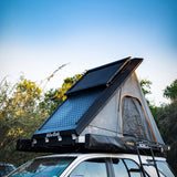 Alu-Cab Roof Rack Tray mounted on top of a Hard Shell Gen3 Rooftop Tent, in a wilderness setting