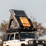 Alu-Cab Roof Rack Tray mounted on top of a Hard Shell Gen3 Rooftop Tent, in a wilderness setting