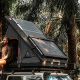 Alu-Cab Roof Rack Tray mounted on top of a Hard Shell Gen3 Rooftop Tent, in a wilderness setting
