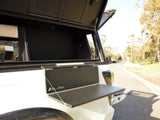 Alu-Cab Side Slide Prep Table on a white Camp4x4 vehicle