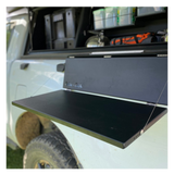 Alu-Cab Side Slide Prep Table on a white Camp4x4 vehicle