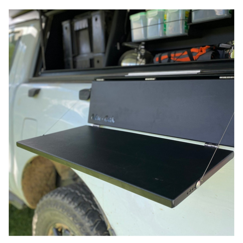 Alu-Cab Side Slide Prep Table on a white Camp4x4 vehicle