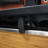 Close-up of a black textured lever handle attached to an Alu-Cab Rear Door Drop-Down Table.