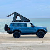 A Camp4x4 rental vehicle, fitted with the Alu-Cab LT-50 Lightweight rooftop tent, at the beach