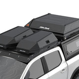 Two black Alu-Cab Roof Boxes and a RT-2S rooftop tent mounted on a white pickup truck bed, shown against a clean white background.