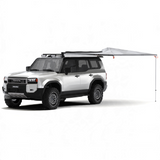 White SUV with an extended Alu-Cab 270 Shadow Awning. Camp4x4. camp 4x4, overlanding, camping.