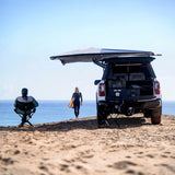 Camp4x4.co.za Alu-Cab 270 Shadow Awning 2.5m mounted on an off-road vehicle on the beach