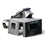 Alu-Cab 270 awning, with the Awning Side Wall Kit and a hard shell rooftop tent, fitted to a camping vehicle