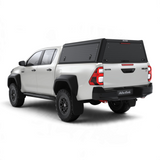Double Cab Toyota Hilux  bukkie / truck with a black Alu-Cab Explorer Canopy with treaded finish. Camp4x4 camp 4x4, overlanding, camping