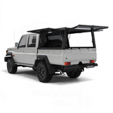 Land Cruiser 79, fitted with the Alu-Cab Explorer Canopy, with doors opened, with treaded or smooth finish. Camp4x4 camp 4x4, overlanding, camping. Double Cab. Single Cab. Extra Cab