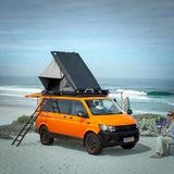 camp4x4.co.za Alu-Cab Gen3-R Hardshell Rooftop Tent mounted on a VW Van parked at the beach