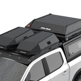 Two black Alu-Cab Roof Boxes and a RT-2S rooftop tent mounted on a white pickup truck bed, shown against a clean white background.