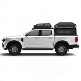 White Off-road bukkie / truck with a Alu-Cab RT2 2 sleeper rooftop tent and storage boxes on a Front unner roof rack and Alu-Cab Contour canopy. Camp4x4. camp 4x4, overlanding, camping. Double Cab. Single Cab. Extra Cab