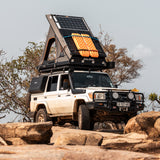 Land Cruiser Off-road vehicle with an Alu-Cab Gen3.R rooftop Tent and roof-mounted solar panel system on a Front Runner roof rack. Camp4x4. camp 4x4, overlanding, camping. Double Cab. Single Cab. Extra Cab 