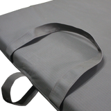 A close up view of the MEERKAT Canvas Roll-Up Mattress, showing the quality canvas material and straps, displayed on a white background