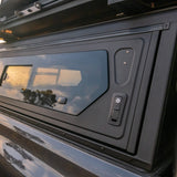 Close-up view of the Alu-Cab Contour Canopy side window and push-button lock. Camp4x4 camp 4x4, overlanding, camping. Double Cab. Single Cab. Extra Cab