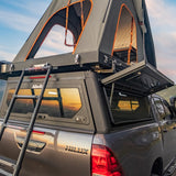 Alu-Cab Gen3.R Roof top tent attached to an Alu-Cab Contour Canopy on Toyota Hilux truck. Camp4x4 camp 4x4, overlanding, camping. Double Cab. Single Cab. Extra Cab
