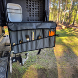 Alu-Cab Cutlery Roll Deluxe on a truck bed with mountains in the background