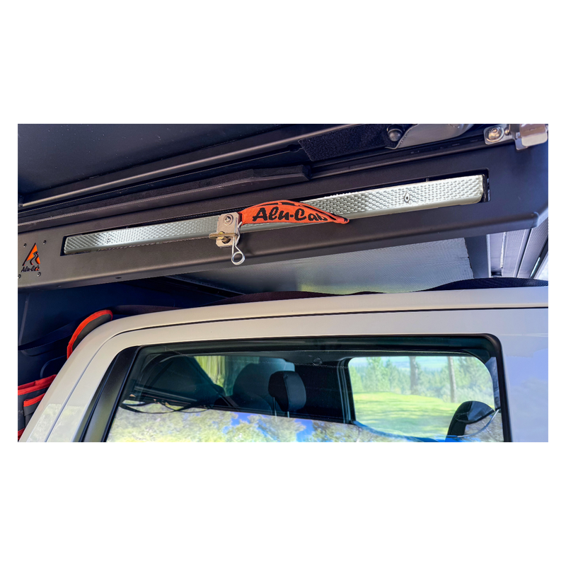 Alu-Cab MODCAP Family Tent Table Slide Fitted to an off-road vehicle on a white background