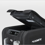 A close up view of the Dometic CFX Fridge Protective Cover on a 55L electric cooler with the door open, on a white background