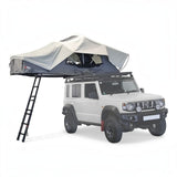 A Front Runner Feather-Lite II Rooftop Tent in an opened up position, on a Campx4 rental vehicle, on a white background