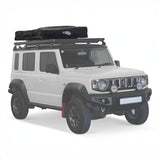 A Front Runner Feather-Lite II Rooftop Tent in closed position, on a Campx4 rental vehicle, on a white background