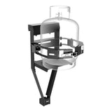 A clear cylindrical tank mounted on a blackFront Runner Land Rover Defender 90/110 Single Gas Bottle Bracket, shown on a plain white background.