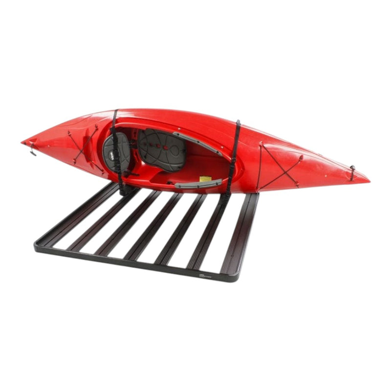 A red kayak secured on a Roof Rack with a Front Runner Pro Canoe / Kayak / SUP Carrier, shown against a plain white background.