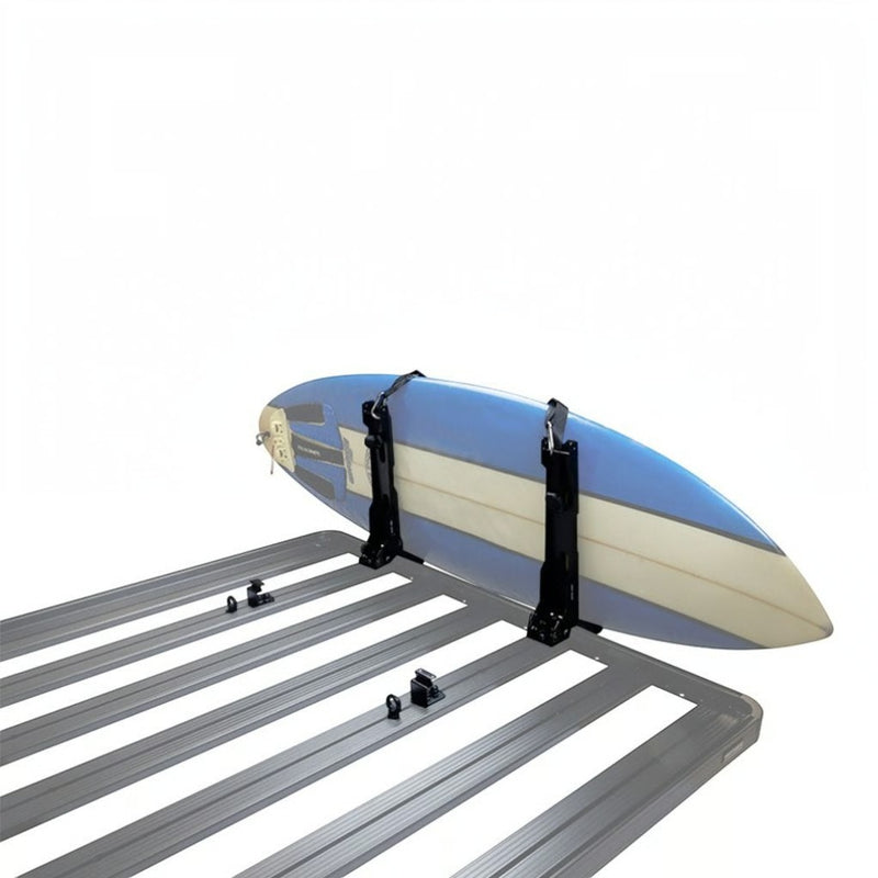 A blue and cream surfboardstrapped to a Front Runner Vertical Surfboard Carrier, mounted on a black roof rack, shown against a plain white background.