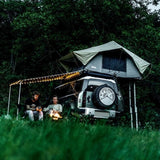 Front Runner Land Rover New Defender(2020-Current) with roof rack and rooftop tent in the outdoors