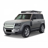 Silver Land Rover Defender SUV with the Front Runner Land Rover New Defender 90 (2020-Current) Slimline II Roof Rack Kit on a white background