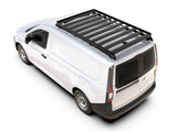 A white cargo van shown from a high-angle rear view on a clean white background, fitted with a black Front Runner Series Volkswagen Caddy Maxi / Ford Transit/Tourneo Connect LWB (2020-Current) Slimline II Roof Rack Kit.