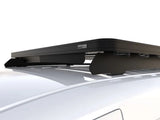 A Front Runner Series Volkswagen Caddy Maxi / Ford Transit/Tourneo Connect LWB (2020-Current) Slimline II Roof Rack Kit mounted on the roof of a white vehicle, shown from a high-angle front-three-quarter view against a clean white background.