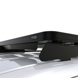 A black Front Runner Series Volkswagen Caddy / Ford Transit/Tourneo Connect SWB (2020-Current) Slimline II Roof Rack Kit, branded 'Front Runner' mounted to the roof rails of a white vehicle, shown against a clean white background.