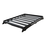 A black Front Runner Series Volkswagen Caddy / Ford Transit/Tourneo Connect SWB (2020-Current) Slimline II Roof Rack Kit, shown at an angle on a plain white background.