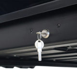 Close-up of a silver metal lock cylinder on a Front Runner Cargo Carrier / 450 Black, with two keys inserted and turned, against a white background at the bottom.