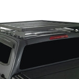 A black metal Front Runner Series Isuzu D-MAX RG/3rd Gen (2020-Current) Slimline II Roof Rack Kit mounted on the roof of a dark gray pickup truck, shown against a plain white background.