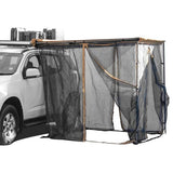 A small SUV with a dark grey Front Runner Series Easy-Out Awning Mosquito Net for a 2M or 2.5M awning, attached to the side, shown on a plain white background.
