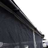 A close up view of a dark blue Front Runner Series Easy-Out Awning Mosquito Net for a 2M or 2.5M awning, attached to the side of a vehicle, shown on a plain white background.