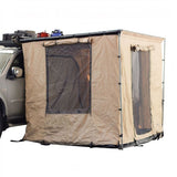 A beige Front Runner Series Easy-Out Awning Room for a 2m or 2.5m Awning with mesh windows, shown attached to the side of a gray vehicle on a white background.