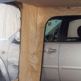 A silver car with an Easy Out Awning installed, and a Front Runner Series Easy-Out Awning Room for a 2m or 2.5m Awning showing the mesh window screen and the attached fabric panel.