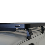Front Runner Suzuki Eeco (2023-Current) Slimline II Roof Rack Kit mounted on a light gray vehicle roof, shown against a plain white background.