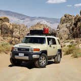 Toyota SUV with Front Runner Toyota FJ Cruiser Slimline II Roof Rack Kit in the outdoors
