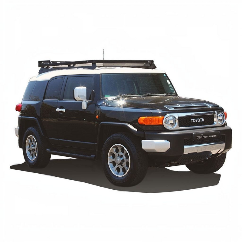 Black Toyota SUV with Front Runner Toyota FJ Cruiser Slimline II Roof Rack Kit on a white background