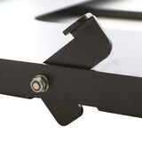 Close-up of a black Front Runner Fridge Slide with a textured steel locking mechanism, shown against a white background.