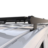 A black Front Runner Toyota HiAce LWB (2019-Current) Slimpro Roof Rack Kit fitted to a white van, shown against a plain white background.